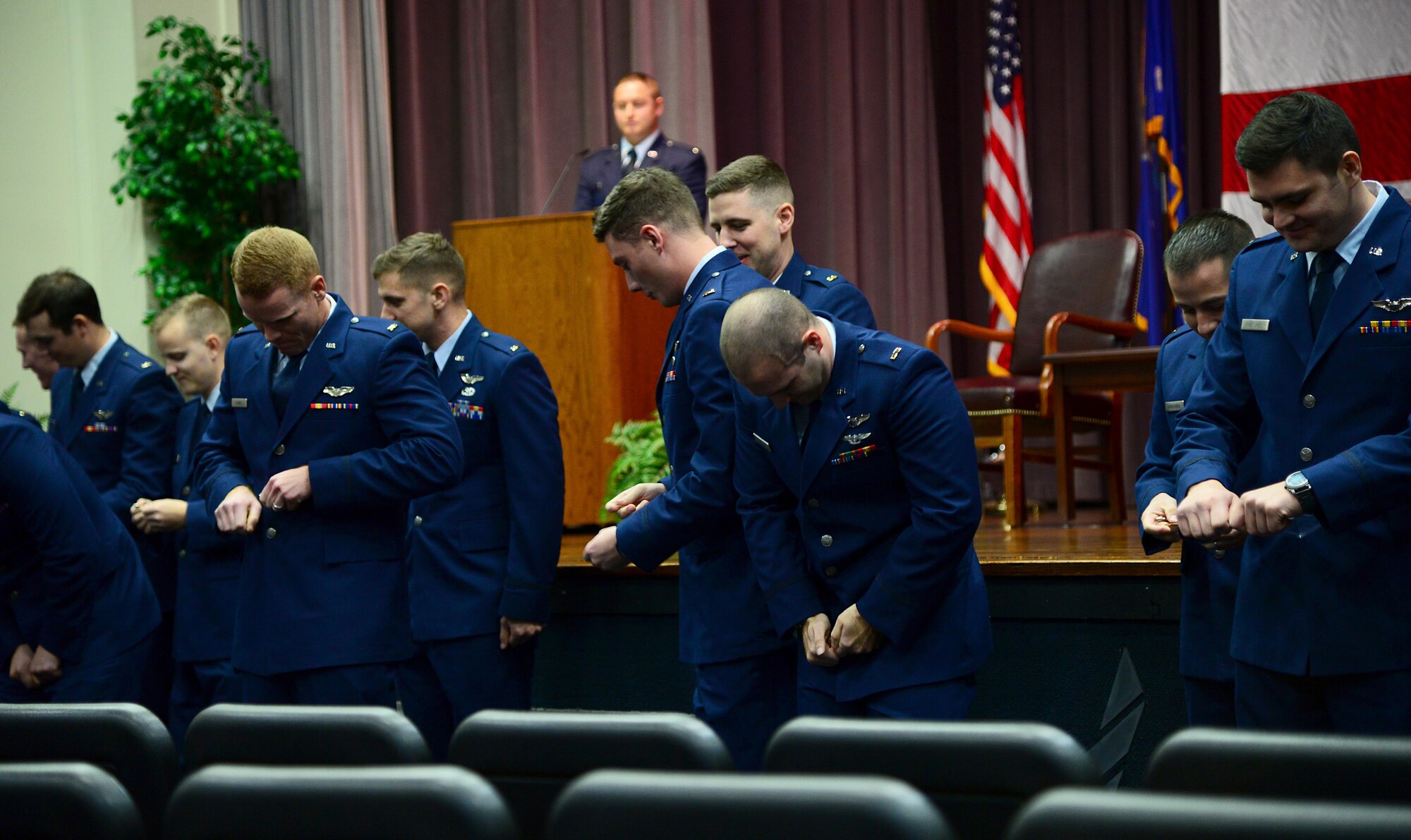 Col. Stephen Snelson, 6th Air Mobility Wing commander, Macdill Air Force Base, Florida, speaks at Specialized Undergraduate Pilot Training Class 19-02’s graduation Nov. 16, 2018, on Columbus Air Force Base, Mississippi. He told the class not to back down from changing and innovating in the face of unwilling superiors, he asked them to be bold and strive for the best they can do at all times, and the final point he explained was to pick their heads up and appreciate what they are doing and what they have done. (U.S. Air Force photo by Airman 1st Class Keith Holcomb)