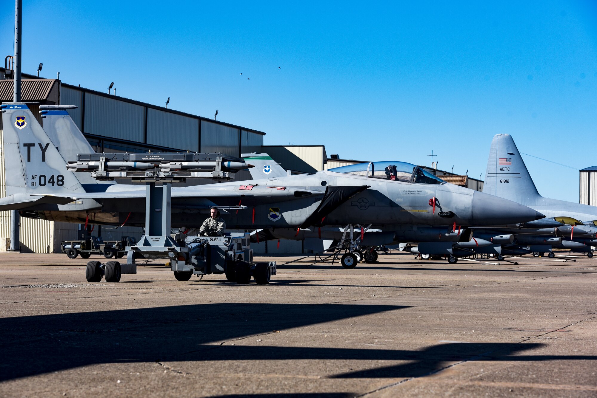 Sheppard Airmen in training work on a C-130 Hercules trainer jet.
