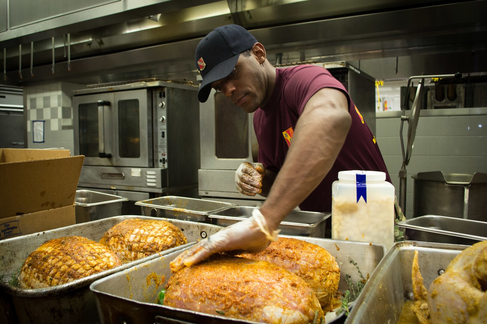 A Culinary Specialist assigned to the 82nd Brigade Support Battalion, 3rd Brigade Combat Team, 82nd Airborne Division prepares hams Monday, November 19, 2018 at the brigade’s dining facility.  

Culinary Specialists from the battalion spent entire night preparing over 640 lbs. of turkey, 558 lbs. of steamship round, 72 lbs. of shrimp, more than 100 pies, approximately 700 servings of sweet potatoes and approximately 800 servings of green bean casserole to serve during the brigade’s Thanksgiving feast the next day.