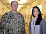 Navy Lt. Cmdr. Jason Galka, a Medical Customer Pharmacy Operations Center pharmacist, left, and Sooyun Kim, a Medical CPOC pharmacist, right, pose for a photo at DLA Troop Support, Nov. 21, 2018 in Philadelphia.