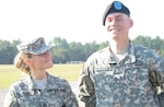 West Virginia Army National Guard (WVARNG) recruiter Staff Sgt. Lynda Tulanowski stands with her son, Aaron, during his graduation from Basic Combat Training nine years ago.