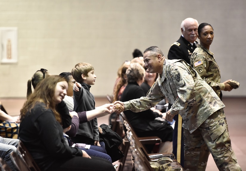 U.S.  Army Command Sergeant Major Thomas Pacheco shakes the hands of family members before the Deployment Ceremony. At Joint Base Langley-Eustis, VA, November 20th, 2018. Families are there to support their soldier before their nine month Deployment. (U.S. Army photo by Spc. Travis Teate)