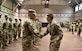 U.S. Army Col. Beth Behn, 7th Transportation Brigade (Expeditionary) commander, shakes hands with outgoing Warrant Officer, vessel master during a deployment ceremony at Joint Base Langley-Eustis, Virginia, Nov. 20, 2018.  Operation Spartan Shield is a nine month rotation in U.S. Central Command area of operation. (U.S. Army photo by Spc. Travis Teate)