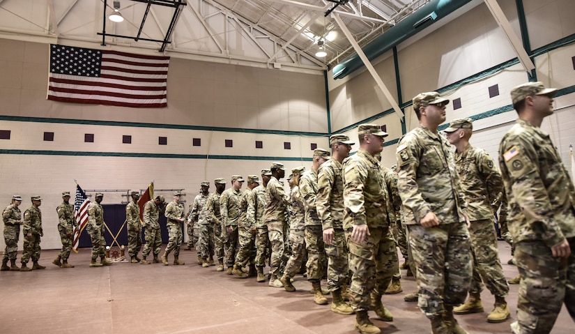 U.S. Army Soldiers, friends and family line up to say farewell to Soldiers of the 97th Transportation Company during a deployment ceremony at Joint Base Langley-Eustis, Virginia, Nov. 20, 2018.  The crew will spend Thanksgiving Day and weekend with their loved ones before deploying. (U.S. Army photo by Spc. Travis Teate)