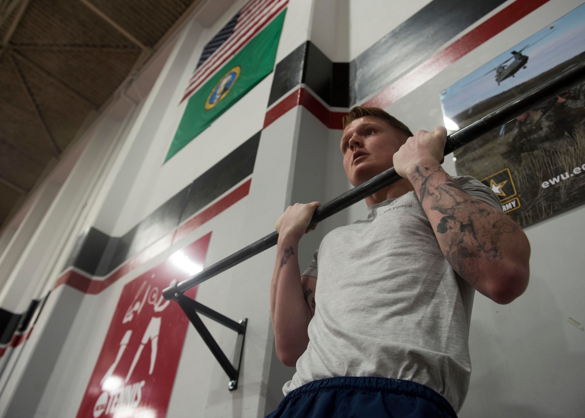 U.S. Air Force Airman 1st Class Tyler Corter, 92nd Medical Operations Squadron medical technician, performs the flexed-arm hang as part of the German Armed Proficiency Badge competition Nov. 17, 2018, at Eastern Washington University in Cheney, Washington. Participants must complete a variety of events covering both basic fitness and military training in order to earn the badge. Events included a sprint test, chin-up test, 1,000-meter run, 100 meter swim in uniform, removing the uniform in water, first-aid, Nuclear Biological Chemical Mission Oriented Protective Posture test, pistol qualification and a ruck-march. (U.S. Air Force photo/Airman 1st Class Lawrence Sena)