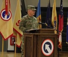 FORT KNOX, Ky. - Col. Sidney Melton, chief of staff for the  1st Theater Sustainment Command, speaks during the deployment ceremony at the Sadowski Center, Nov 19. The team, comprised of Soldiers and Department of the Army Civilians, deploying to Kuwait where they will assume the Strategic Operations and Plans (SOaP) mission. (U.S. Army photo by Spc. Zoran Raduka)