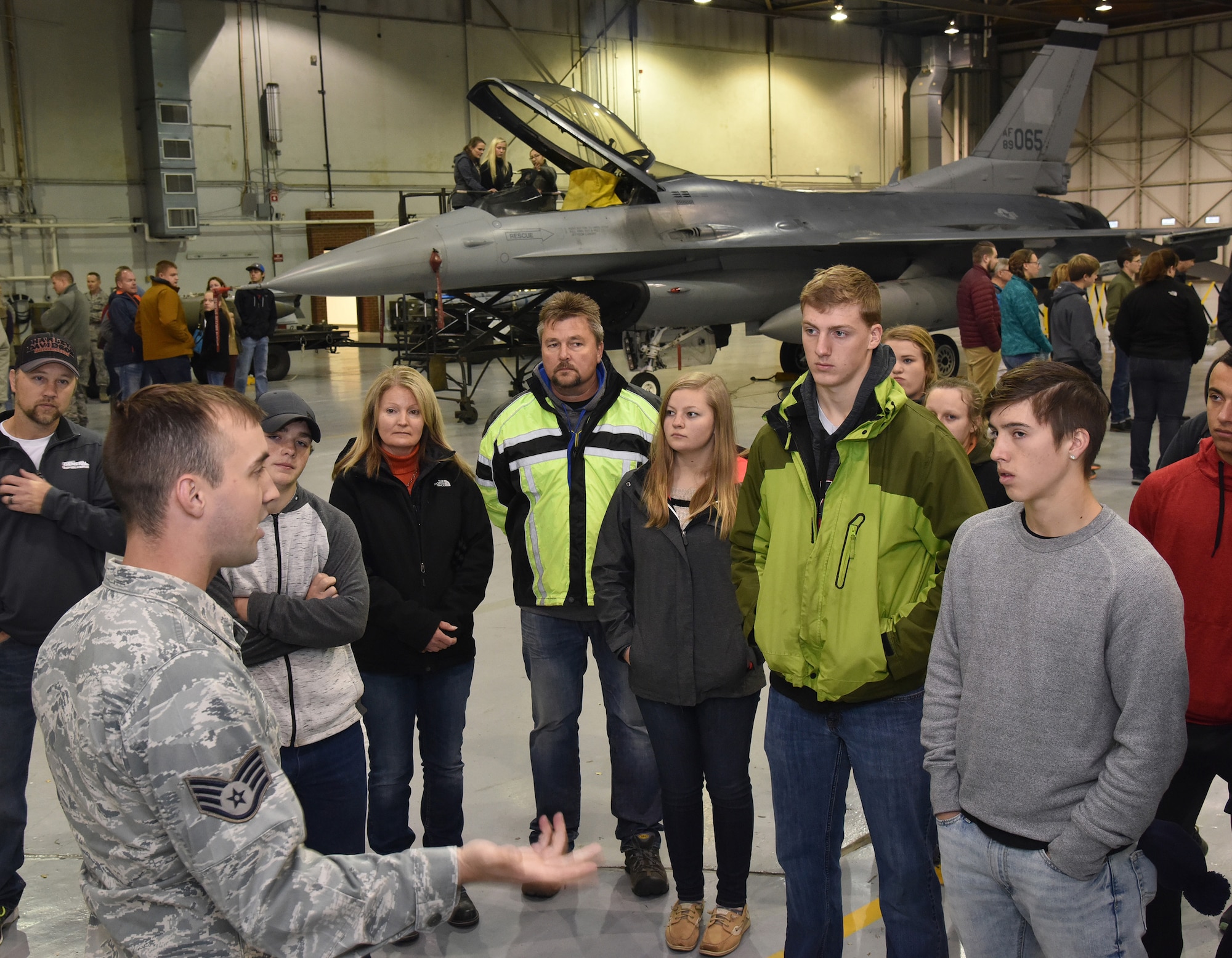 Staff Sgt. Isaac Druin, 114th Civil Engineer Squadron emergency management technician, explains to career day attendees about the functions of the Mobile Emergency Operation Center and the benefits of his career with the 114th Fighter Wing.