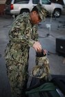 Navy Petty Officer 1st Class Albert A. Givens unpacks a satellite, part of the Mobile User Objective Service (MUOS), SATCOM system at Joint Task Force Civil Support (JTF-CS) on Nov. 19, 2018. The compact satellite enables signal communication in any crisis response. When directed, JTF-CS is ready to respond in 24 hours to provide command and control of 5,200 federal military forces located at more than 36 locations throughout the nation in support of civil authority response operations to save lives, prevent further injury and provide critical support to enable community recovery. (Official DoD photo by U.S Air Force Tech. Sgt. Michael Campbell/ Released)