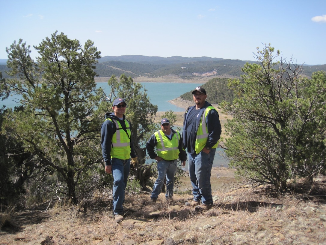 TRINIDAD LAKE, Colo. – District maintenance staff stop for a photo while conducting boundary line surveys, April 1, 2018. (l-r): Jesse Gutierrez, Joseph “Rick” Torres, and Matt Gonzales. Photo by Kim Falen. This was a 2018 photo drive entry.