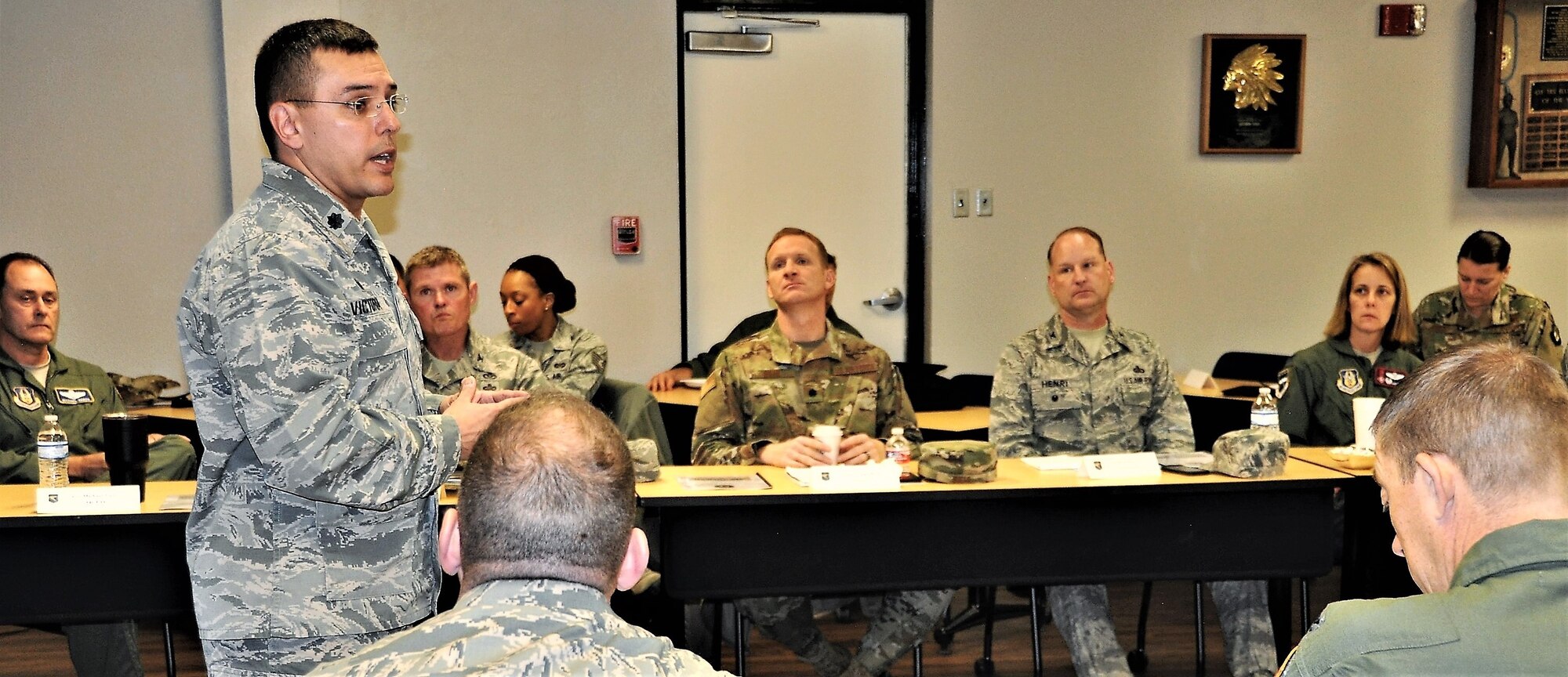 Lt. Col. Christopher Victoria, 433rd Training Squadron commander, provides a mission brief during the 22nd Air Force Senior Leader Summit Nov. 14 at Joint Base San Antonio-Lackland, Texas. (U.S. Air Force photo by Janis El Shabazz).