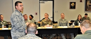 Lt. Col. Christopher Victoria, 433rd Training Squadron commander, provides a mission brief during the 22nd Air Force Senior Leader Summit Nov. 14 at Joint Base San Antonio-Lackland, Texas. (U.S. Air Force photo by Janis El Shabazz).