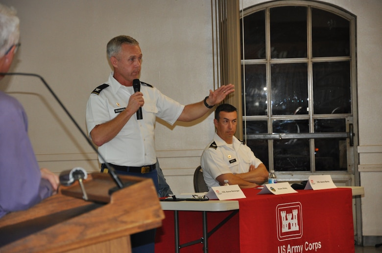 Col. Aaron Reisinger, commander of the U.S. Army Corps of Engineers Chicago District, speaks to community members during a public meeting about the Westminster/East Garden Grove Flood Risk Management Study, as Col. Aaron Barta, the Corps' Los Angeles District commander, looks on Nov. 7 in Westminster, California.