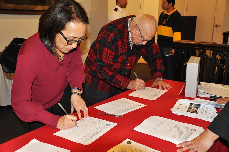 Community members who live in the Westminster Watershed sign in before the start of a Nov. 8 public meeting about the Westminster/East Garden Grove Flood Risk Management Study in Huntington Beach, California.