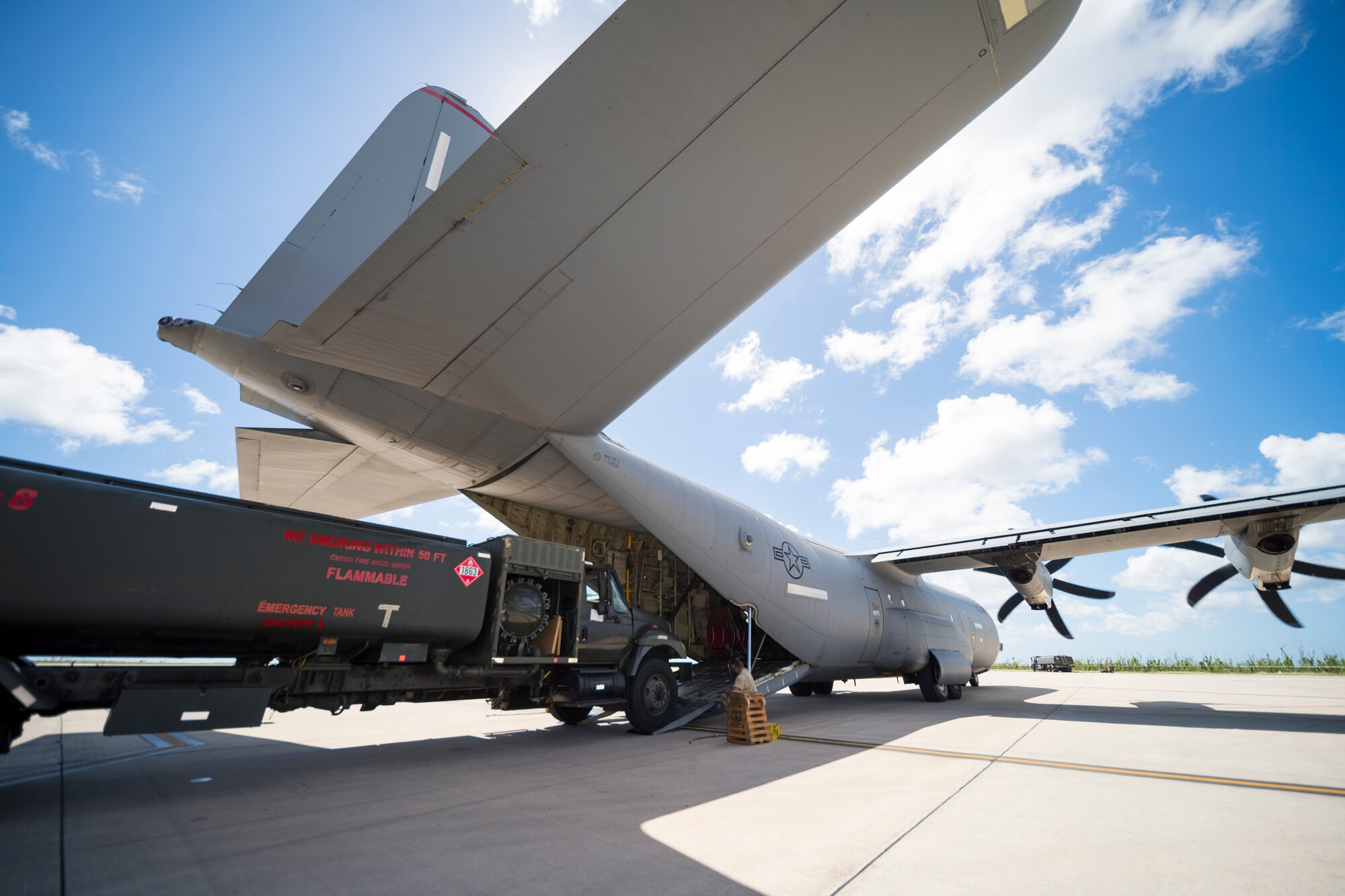 Airmen with the 36th Mobility Response Squadron, assigned to Andersen Air Base, Guam, load a fuel truck onto a C-130J Super Hercules during flight line operations in Saipan, Commonwealth of the Northern Mariana Islands, Nov. 20, 2018, as part of the Super Typhoon Yutu relief effort.