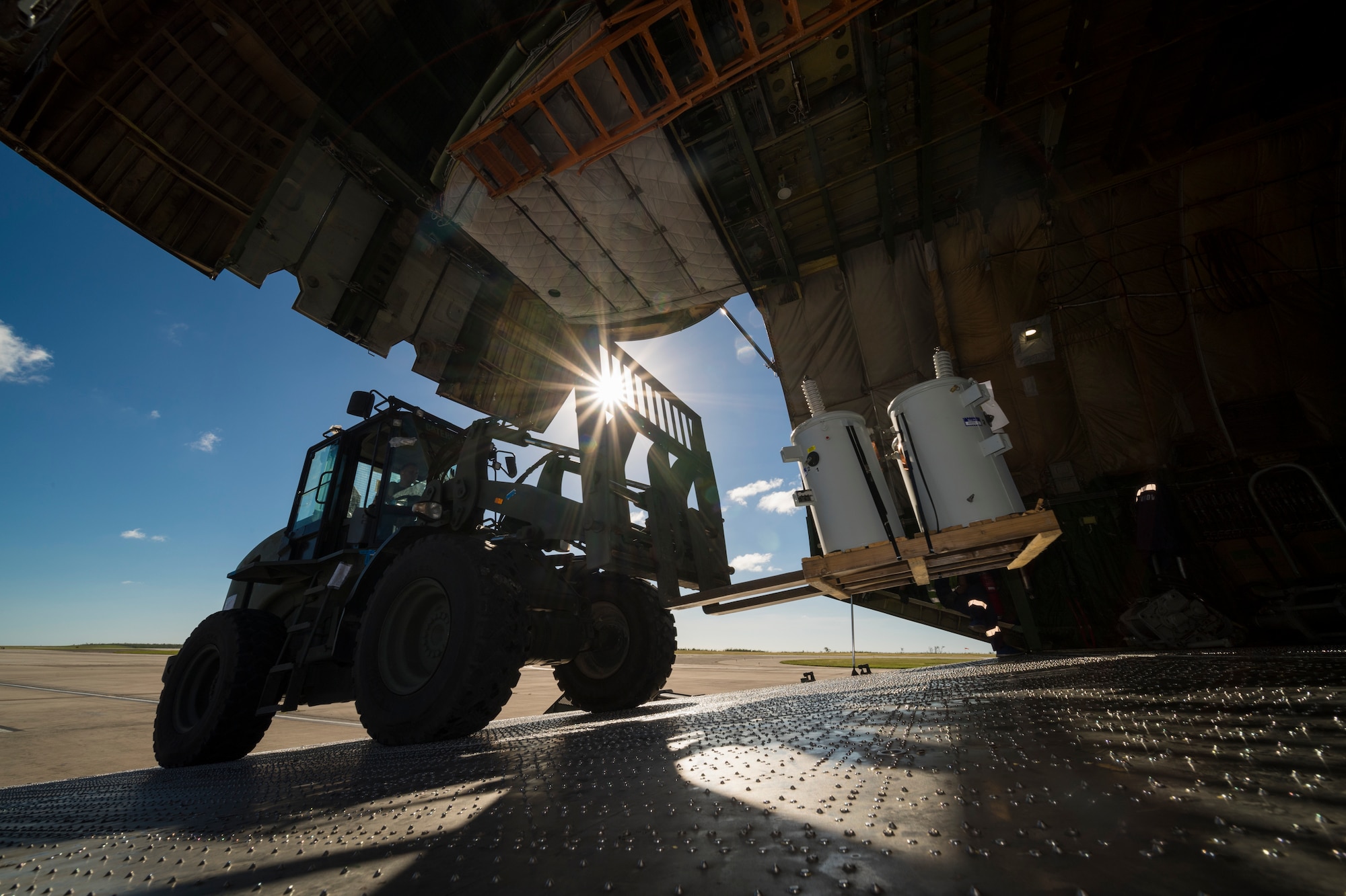 Tech. Sgt. Edward Feilen, 36th Mobility Response Squadron aerial port flight assistant NCO in charge assigned to Andersen Air Force Base, Guam, operates a forklift during flight line operations in Saipan, Commonwealth of the Northern Mariana Islands, Nov. 20, 2018, as part of the Super Typhoon Yutu relief effort.