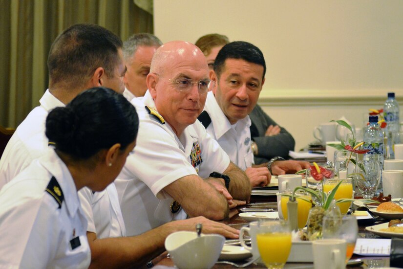 Senior U.S. and Guatemalan military officials sit at a table during a meeting