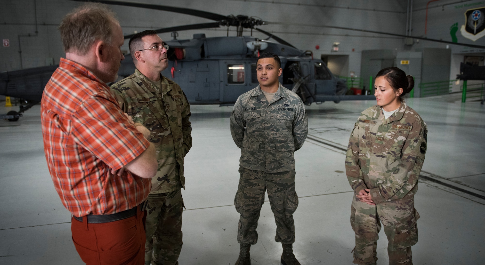 Dr. Daniel Cottam talks to Airmen assigned to the 823rd Maintenance Squadron at Nellis Air Force Base, Nevada, Nov. 16, 2018. The Airmen were part of the team who launched the helicopters that rescued Cottam after a hiking accident. (U.S. Air Force photo by Airman 1st Class Andrew D. Sarver)