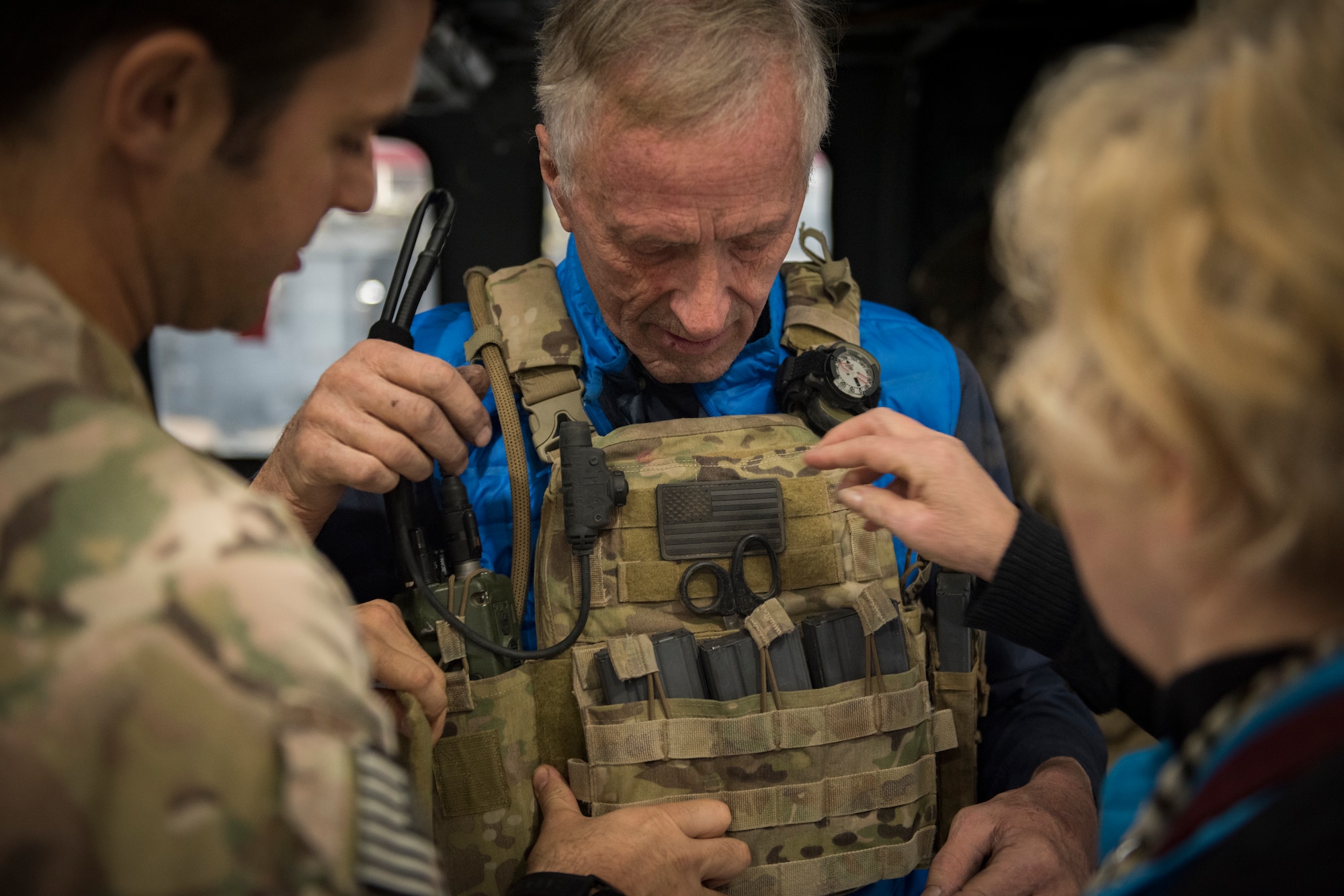 Spencer Cottam tries on a tactical vest in the 823rd Maintenance Squadron hangar at Nellis Air Force Base, Nevada, Nov. 16, 2018. Having taken part in multiple rescues as a civilian, Spencer described the 66th Rescue Squadron as one of the most professional and precise rescues he has ever seen. Spencer visited the 66th RQS with his nephew Dr. Daniel Cottam, following Dr. Cottam’s rescue after a fall near Zion Canyon left him severely injured. (U.S. Air Force photo by Airman 1st Class Andrew D. Sarver)