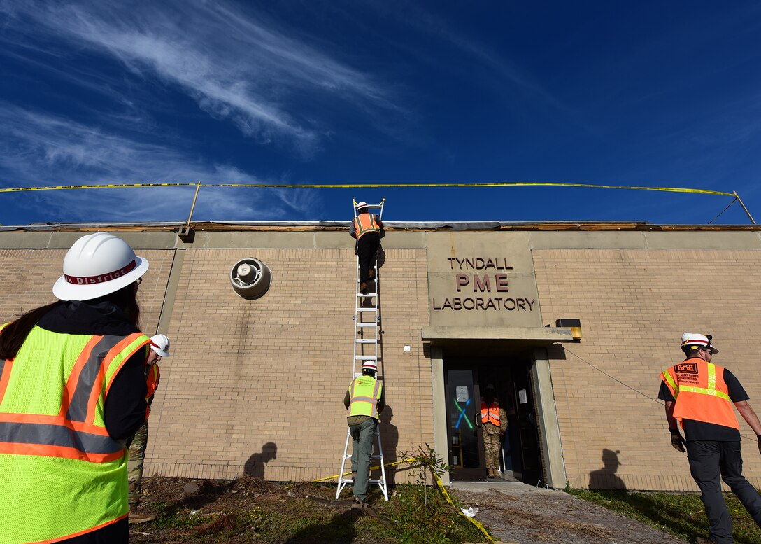 Forward Engineer Support Team members from the Army Corps of Engineers perform a building inspection at Tyndall Air Force Base, Fla., Nov. 21, 2018. The FEST team is comprised of engineers from several fields of study ranging from environmental engineering to civil and structural engineering and is one of nine such teams within the corps. While at Tyndall, the team has a goal of completing inspections on 60 buildings. (U.S. Air Force photo by Senior Airman Isaiah J. Soliz)