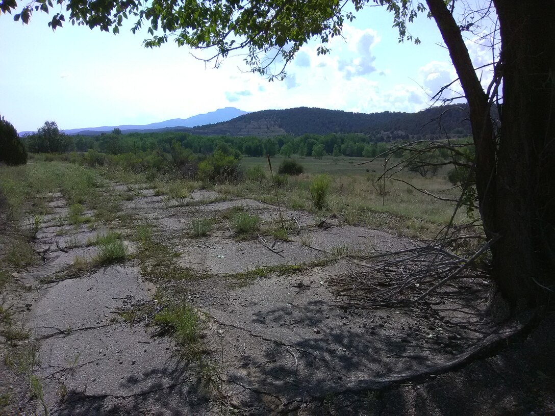 TRINIDAD, Colo. – View of Fisher’s Peak across Trinidad Lake as seen from the west end of the project’s property, Aug. 10, 2018. The road is an old portion of state highway 12, which was relocated when the dam was built. Photo by Kim Falen. This was a 2018 photo drive entry.