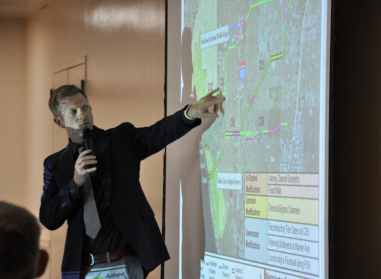 Justin Golliher with the Engineering Division of the Orange County Public Works, points out an area on the map of the Westminster Watershed for a community member during a Nov. 7 public meeting about the Westminster/East Garden Grove Flood Risk Management Study in Westminster, California. The U.S. Army Corps of Engineers Chicago and Los Angeles districts are partnering with the Orange County Public Works on a proposed project to reduce flood risk in the area.