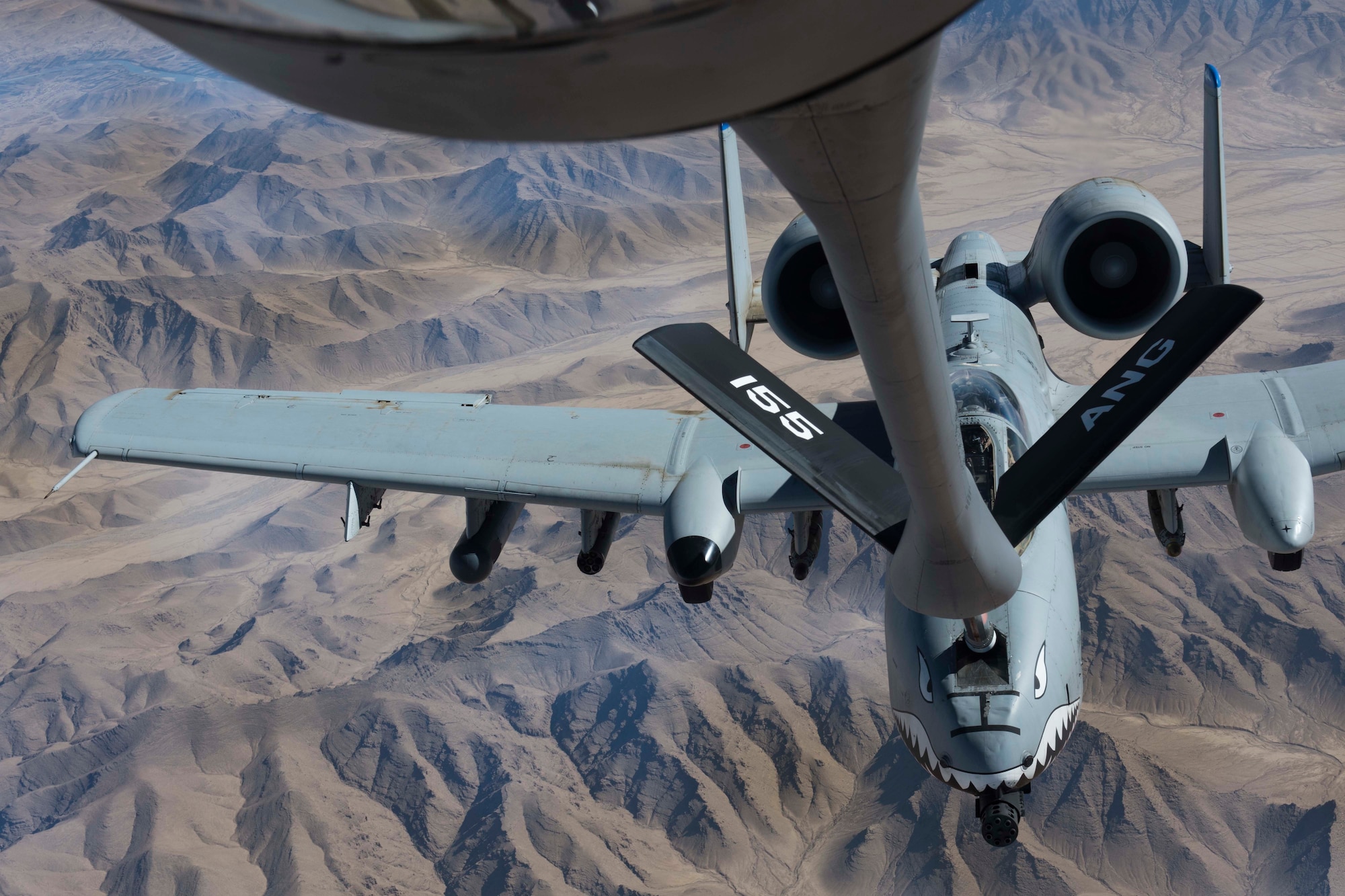 An A-10 Thunderbolt II, assigned to the 75th Expeditionary Fighter Squadron, receives fuel from a KC-135 Stratotanker, assigned to the 340th Expeditionary Air Refueling Squadron, while flying over Kandahar Province, Afghanistan, Nov. 18, 2018.