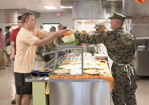 Navy Adm. Kurt W. Tidd, Commander, U.S. Southern Command, visited Joint Task Force Guantanamo Troopers to celebrate the Thanksgiving holiday as one of his final acts as commander, Nov. 22. Tidd was joined by incoming SOUTHCOM Commander, Navy Adm. Craig S. Faller; Marine Sgt. Maj. Bryan K. Zickefoose, SOUTHCOM Command Senior Enlisted Leader; and JTF GTMO leaders, to visit Troopers on duty and serve Thanksgiving lunch at the Camp America Galley.