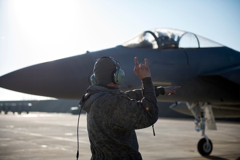 A maintainer assigned to the 493rd Aircraft Maintenance Unit taxis out an F-15C Eagle assigned to the 493rd Fighter Squadron for a sortie in support of the NATO Tactical Leadership Programme 18-4 at Amendola Air Base, Italy, Nov. 22, 2018. F-15C Eagles and an F-15D Eagle will be participating in the NATO Tactical Leadership Programme 18-4. TLP has prepared hundreds of NATO and allied forces’ flight leaders to be mission commanders. (U.S. Air Force photo/ Senior Airman Malcolm Mayfield)