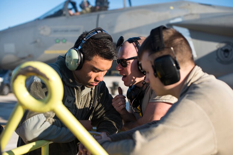 Maintainers assigned to the 493rd Aircraft Maintenance Unit discuss an F-15C Eagle assigned to the 493rd Fighter Squadron prior to its sortie in support of the NATO Tactical Leadership Programme 18-4 at Amendola Air Base, Italy, Nov. 21, 2018. F-15C Eagles and an F-15D Eagle will be participating through mid December in the NATO Tactical Leadership Programme 18-4. This event marks the first time the course has been held in Italy, from its normal host location at Albacete Air Base, Spain. (U.S. Air Force photo/ Senior Airman Malcolm Mayfield)