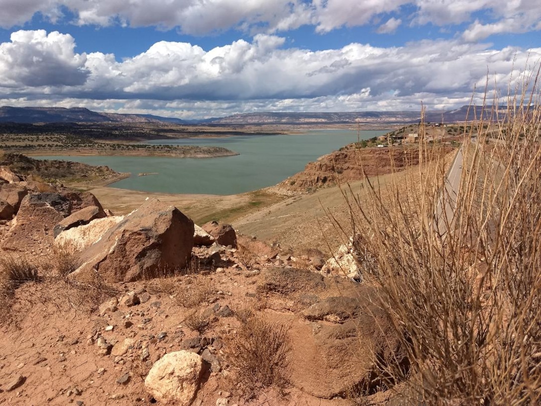 ABIQUIU LAKE, N.M. – Clouds dot the sky over the lake, July 1, 2018, as seen from the piezometer road. Photo by Clarence Maestas. This was a 2018 photo drive entry.