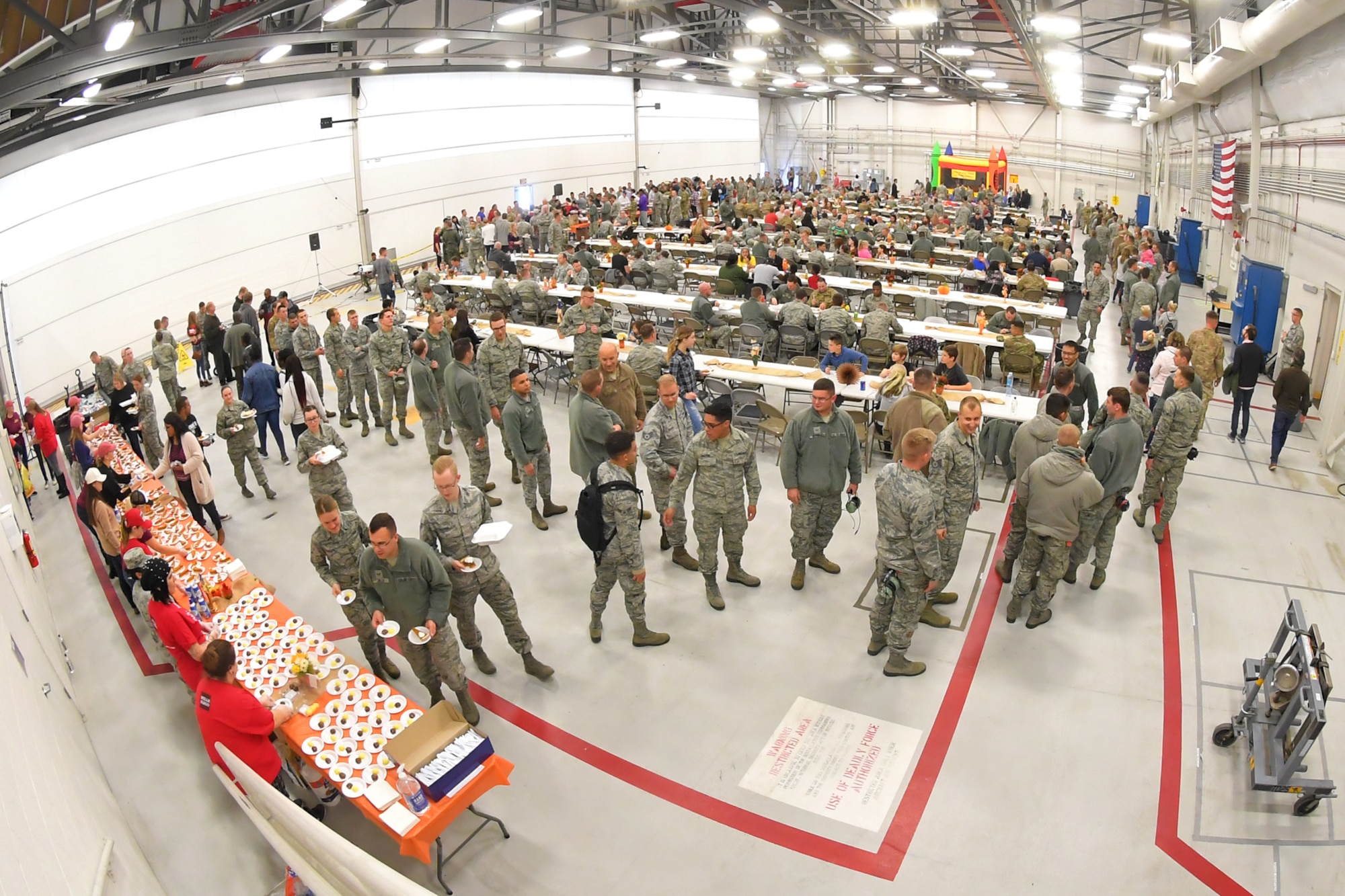 Hundreds of Airmen from the 419th and 388th Fighter Wings gather in an F-35 hangar for an early Thanksgiving Nov. 21. at Hill Air Force Base, Utah.
