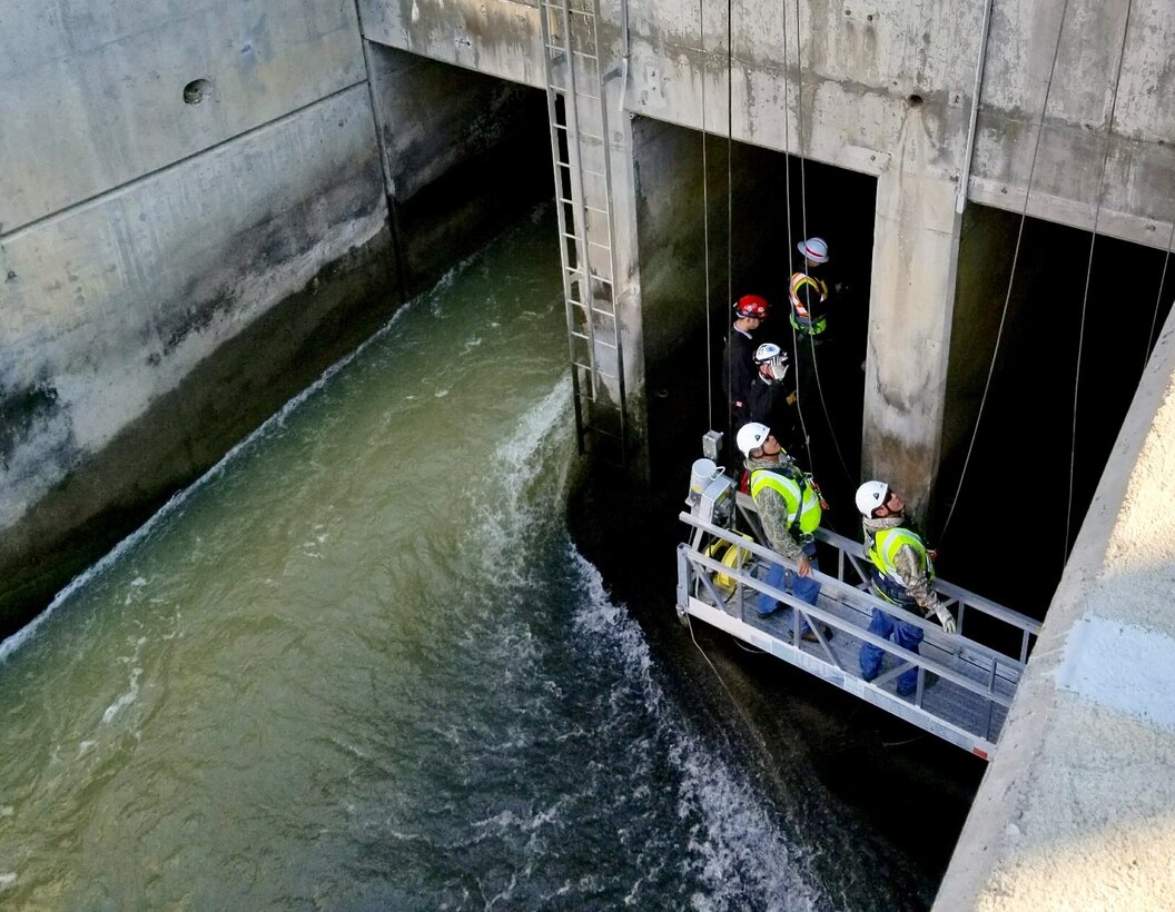 COCHITI DAM, N.M. – The inspection team enters one of the dam’s three conduits during a Hydraulic Steel Structure Inspection, Nov. 13, 2017. The three conduits measure approximately 1,354 feet in length. Photo by Tracy Wolf. This was a 2018 photo drive entry.
