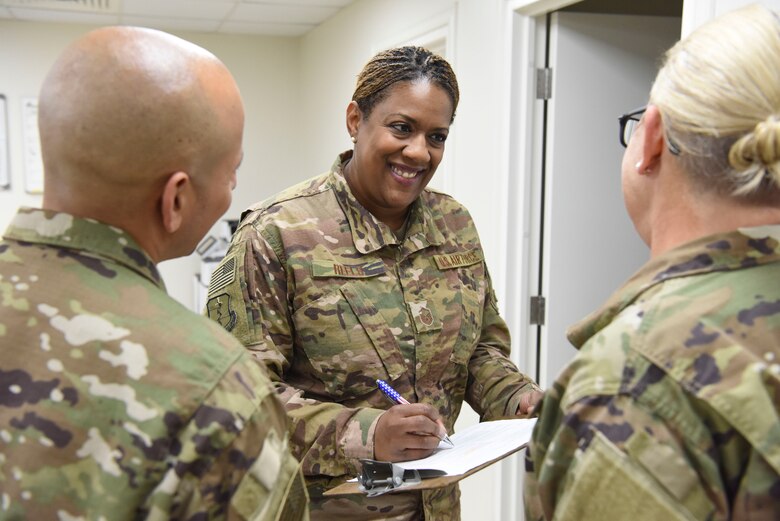 Master Sgt. Lolita Reels, 380th Expeditionary Medical Group public health craftsman, conducts a briefing about her workspace inspection findings Nov. 21, 2018, at Al Dhafra Air Base, United Arab Emirates.