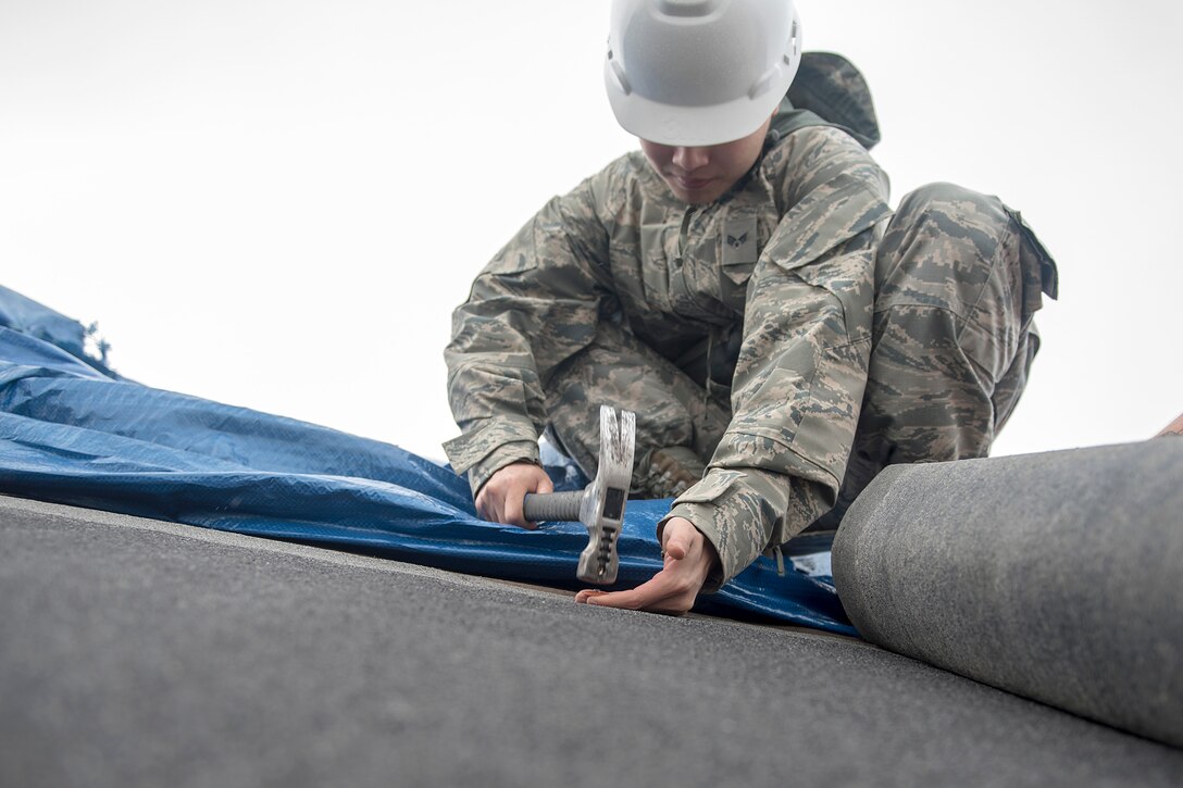 TF Phoenix Airmen repair building roofs