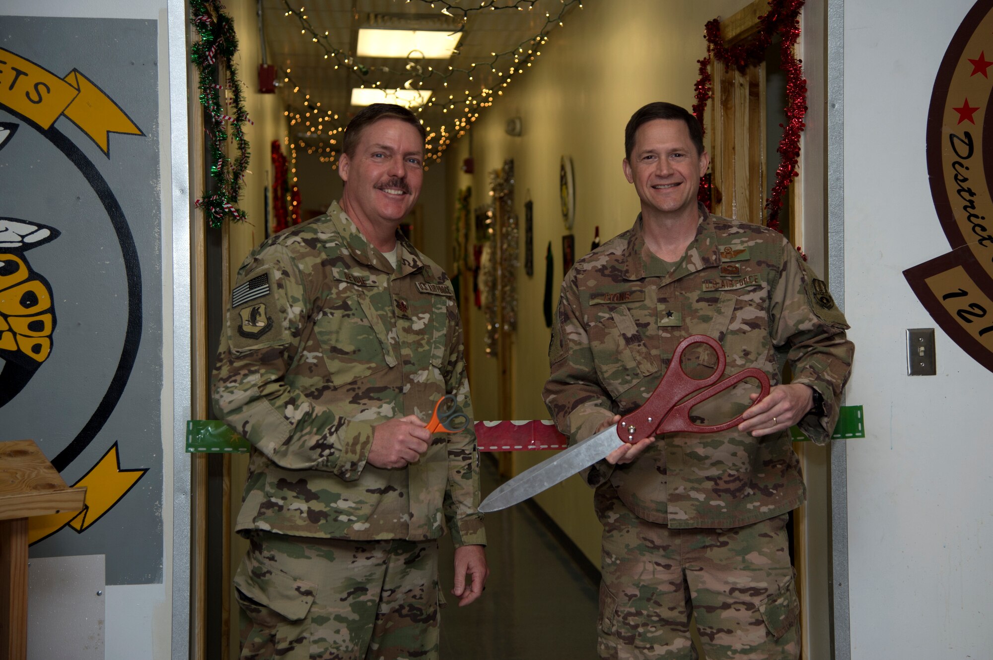 Chaplain (Maj.) Kenneth Devoie, 455th Air Expeditionary
Wing chaplain corps, and Brig. Gen. David Lyons, 455th AEW commander, cut the ribbon on a new Airman Ministry Center at Bagram Airfield Nov. 21, 2018.