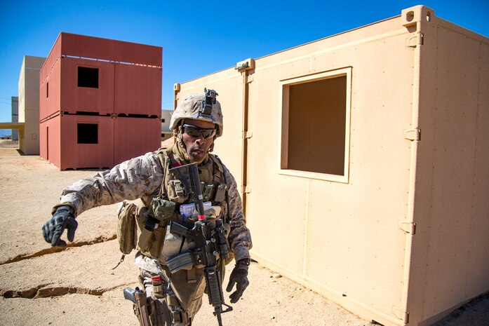 Staff Sgt. Andre Stephens leads Marines during urban effects training on Camp Wilson, Marine Corps Air Ground Combat Center Twentynine Palms, California, Nov. 12, 2018. Marines with Transportation Services Company, Combat Logistics Battalion 4, Combat Logistics Regiment 3, 3rd Marine Logistics Group, maneuvered through a simulated combat town in tactical vehicles to improve efficiency in combat environments. ITX 1-19 is a large-scale Marine Air-Ground Task Force integration exercise in which CLB-4 Marines and Sailors train to respond quickly to any contingency by fully integrating with ground and air combat elements of the MAGTF. Stephens is a native of St. Thomas, Jamaica. (U.S. Marine Corps photo by Cpl. Joshua Pinkney)
