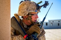 Lance Cpl. Corey Hill radios in his position during urban effects training on Camp Wilson, Marine Corps Air Ground Combat Center Twentynine Palms, California, Nov. 12, 2018. Marines with Transportation Services Company, Combat Logistics Battalion 4, Combat Logistics Regiment 3, 3rd Marine Logistics Group, maneuvered through a simulated combat town with vehicles in order to improve efficiency in combat environments. ITX 1-19 is a large-scale Marine Air-Ground Task Force integration exercise in which CLB-4 Marines and Sailors train to respond quickly to any contingency by fully integrating with ground and air combat elements of the MAGTF. Hill is a native of Shreveport, Louisiana.  (U.S. Marine Corps photo by Cpl. Joshua Pinkney)