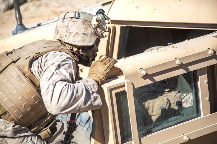 Sgt. Aphiah Liburd checks on casualties during urban effects training on Camp Wilson, Marine Corps Air Ground Combat Center Twentynine Palms, California, Nov. 12, 2018. Marines with Transportation Services Company, Combat Logistics Battalion 4, Combat Logistics Regiment 3, 3rd Marine Logistics Group, maneuvered through a simulated combat town with vehicles in order to improve efficiency in combat environments. ITX 1-19 is a large-scale Marine Air-Ground Task Force integration exercise in which CLB-4 Marines and Sailors train to respond quickly to any contingency by fully integrating with ground and air combat elements of the MAGTF. Liburd is a native of Atlanta, Georgia. (U.S. Marine Corps photo by Cpl. Joshua Pinkney)