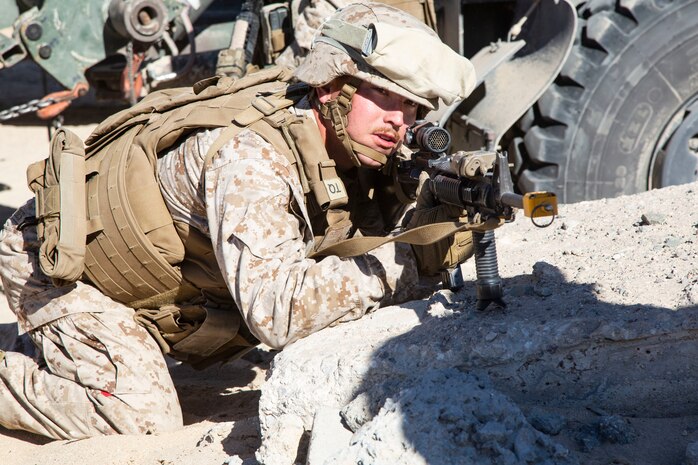 Lance Cpl. Trevin Valdes sights in on a target during urban effects training on Camp Wilson, Marine Corps Air Ground Combat Center Twentynine Palms, California, Nov. 12, 2018. Marines with Transportation Services Company, Combat Logistics Battalion 4, Combat Logistics Regiment 3, 3rd Marine Logistics Group, maneuvered through a simulated combat town with vehicles in order to improve efficiency in combat environments. ITX 1-19 is a large-scale Marine Air-Ground Task Force integration exercise in which CLB-4 Marines and Sailors train to respond quickly to any contingency by fully integrating with ground and air combat elements of the MAGTF. Valdes is a native of Tampa, Florida. (U.S. Marine Corps photo by Cpl. Joshua Pinkney)