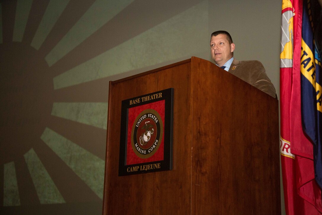 Retired U.S. Marine Lt. Col. Edward T. Nevgloski, an Edwin N. McClellan research fellow at the Marine Corps University in Quantico, Va., share historical knowledge on the Battle of Tarawa during the 75th Anniversary ceremony on Camp Lejeune, N.C., Nov. 20, 2018. Marines and Sailors assigned to 2nd Marine Division honored those who served in the battle by conducting a historical overview followed by a ceremony. (U.S. Marine Corps photo by Cpl. Tojyea G. Matally)