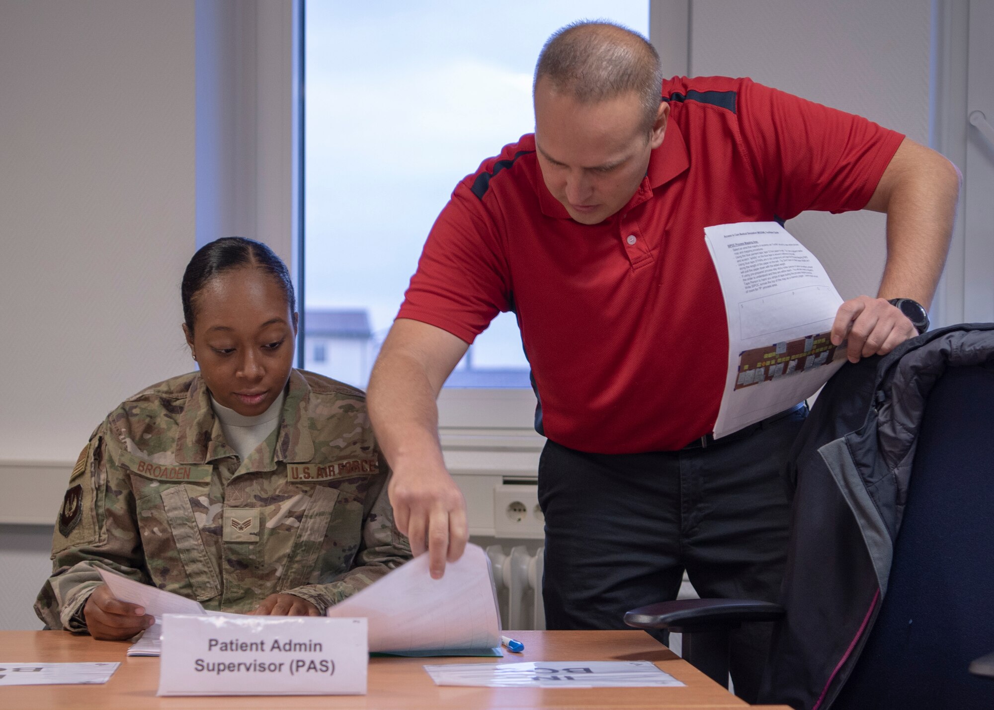 U.S. Air Force Senior Airman Alexandra Broaden, 52nd Civil Engineer Squadron contracting officer representative, and Master Sgt. Christopher Patten, 52nd Fighter Wing Innovation and Transformation Office problem identification training instructor, discuss details of a process improvement exercise during PIT, at Spangdahlem Air Base, Germany, Nov. 20, 2018.