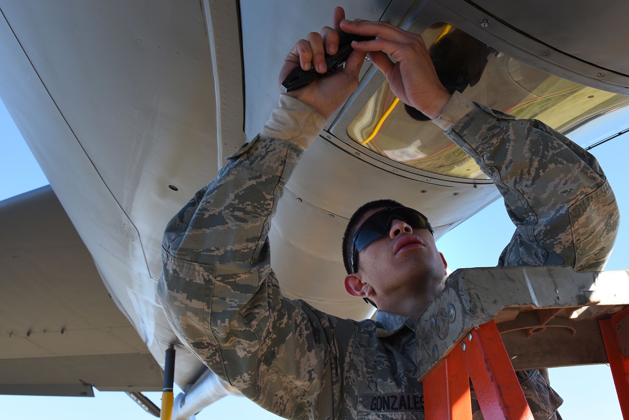 U.S. Air Force Airman 1st Class Richard Gonzales, 22nd Expeditionary Aircraft Maintenance Unit KC-135 Stratotanker crew chief, replaces a boom sighting window at Incirlik Air Base, Turkey, Nov. 15, 2018.