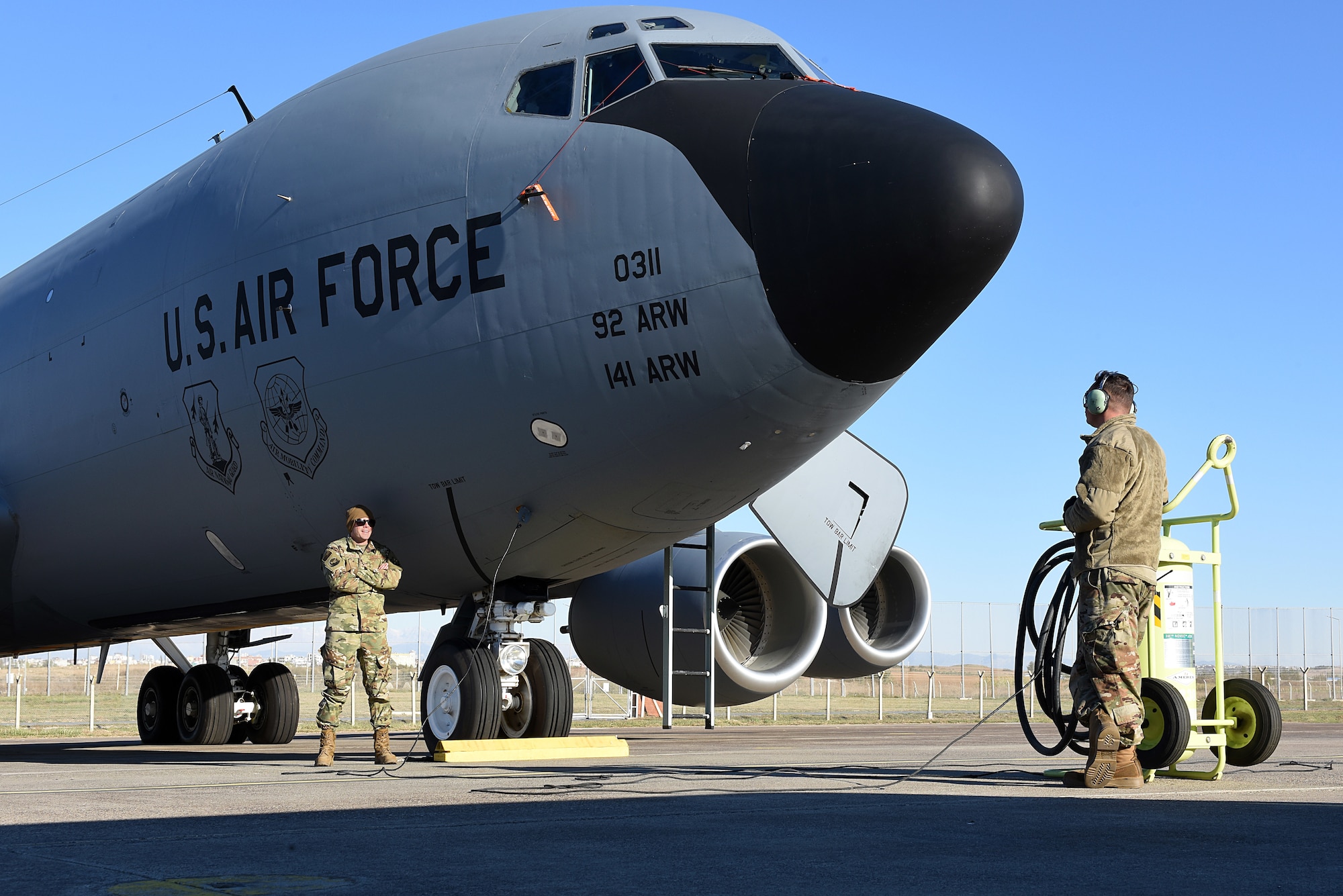 U.S. Air Force Staff Sgt. Pablo Sclafani and Staff Sgt. Damian Pittack, 22nd Expeditionary Aircraft Maintenance Unit KC-135 Stratotanker crew chiefs, perform an alert daily inspection at Incirlik Air Base, Turkey, Nov. 15, 2018.