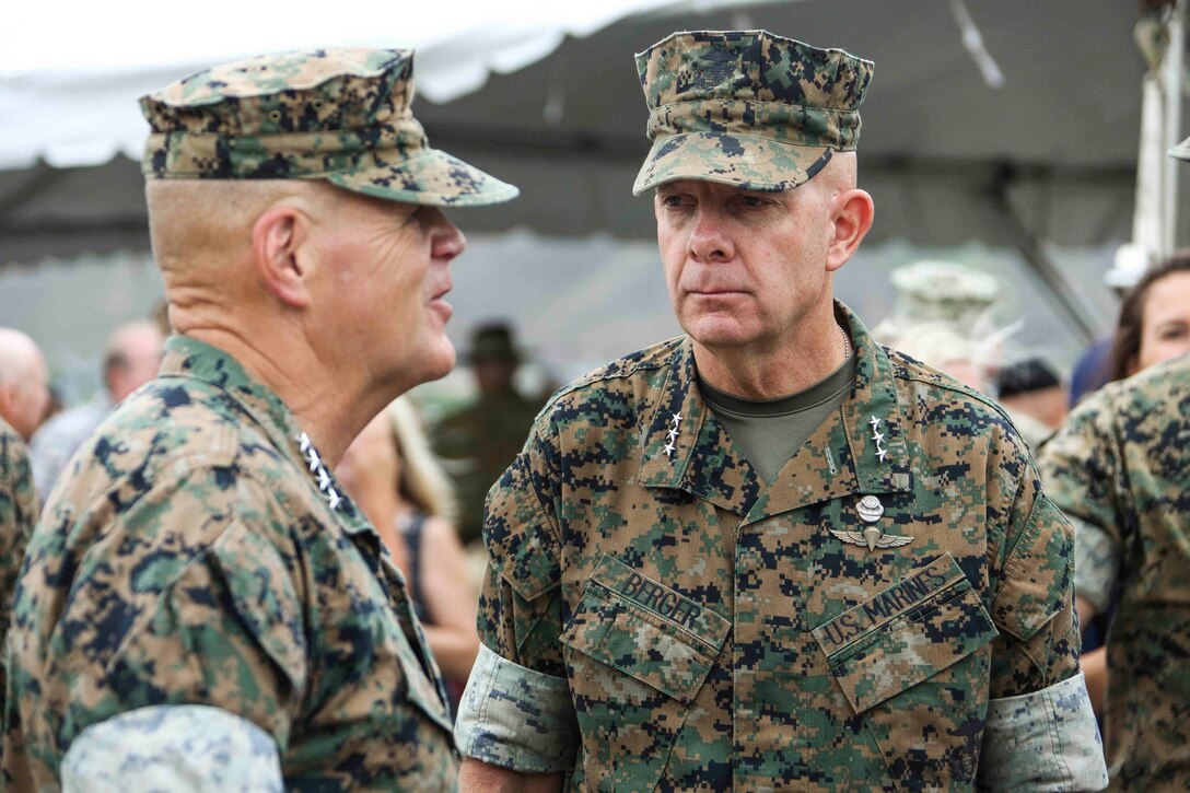 Commandant of the Marine Corps Gen. Robert B. Neller, left, speaks to Lt. Gen. David H. Berger
