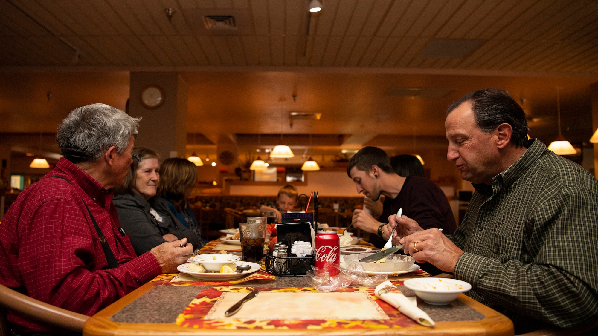 Members of the Monroe family eat their Thanksgiving meal at Kirtland, Nov. 22, 2018. The Monroe family, who has had three members of their family serve in the Air Force, has celebrated Thanksgiving at Thunderbird Inn every year for the last six years. (U.S. Air Force Photo by Airman 1st Class Austin J. Prisbrey)