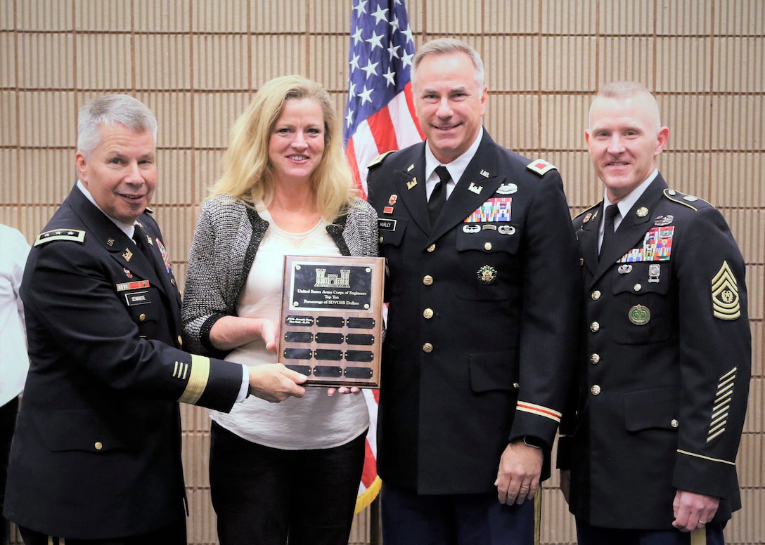 Lt. Gen. Todd T. Semonite, left, and Command Sgt. Maj. Bradley J. Houston, far right, present Huntsville Center’s Office of Small Business Initiatives Chief Rebecca Goodsell and Huntsville Center Commander Col. John S. Hurley with one of several awards and recognitions during the recent 2018 Society of American Military Engineers Small Business Conference in New Orleans.