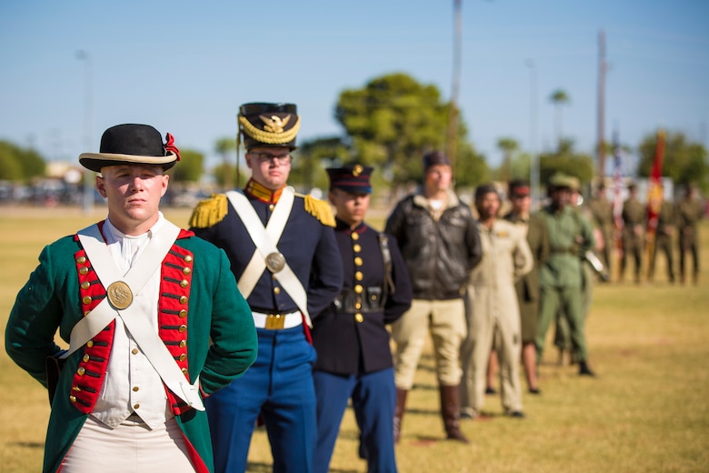 U.S. Marines with Headquarters and Headquarters Squadron, Marine Corps Air Station Yuma, participate in the 243rd Marine Corps birthday uniform pageant at the Parade Deck on Marine Corps Air Station Yuma, Ariz., Nov. 8, 2018. The annual ceremony was held in honor of the 243rd Marine Corps birthday, showcasing historical uniforms to honor Marines of the past, present and future while signifying the passing of traditions from one generation to the next. (U.S. Marine Corps photo by Sgt. Allison Lotz)
