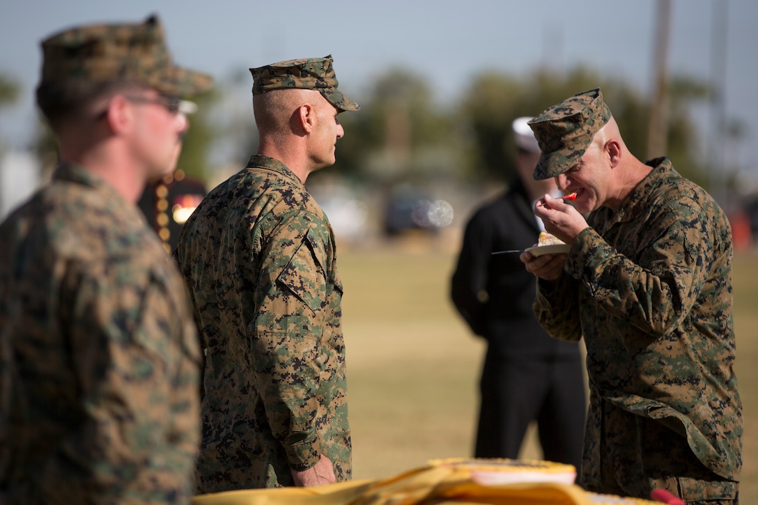 U.S. Marine Corps Sgt. Maj. David M. Leikwold, sergeant major, Marine Corps Air Station Yuma, takes the first bite of cake while participating in the 243rd Marine Corps birthday uniform pageant at the Parade Deck on Marine Corps Air Station Yuma, Ariz., Nov. 8, 2018. The annual ceremony was held in honor of the 243rd Marine Corps birthday, showcasing historical uniforms to honor Marines of the past, present and future while signifying the passing of traditions from one generation to the next. (U.S. Marine Corps photo by Sgt. Allison Lotz)
