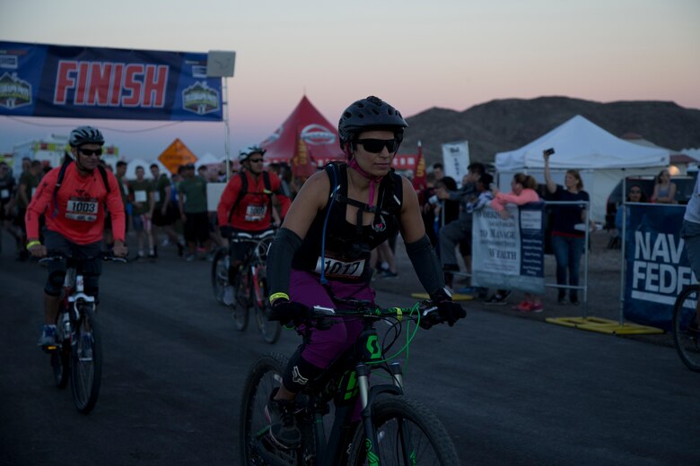 A competitor within the bike route participates in the first annual Telegraph Pass Challenge in Yuma, Ariz., Nov. 3, 2018. The challenge, coordinated by Marine Corps Community Services (MCCS), offered participants the opportunity to compete for first, second, or third place in either a 5 mile run, 5 mile bike route, or both. The course included a "Blue Mile" which is typically the most difficult portion of the racing event being a silent mile. The "Blue Mile" honors and remembers all fallen heroes of the Military, Police, and Fire Department. (U.S. Marine Corps photo by Lance Cpl. Joel Soriano)