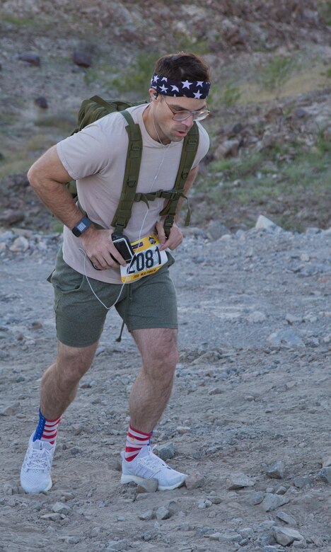 A competitor within the run route participates in the first annual Telegraph Pass Challenge in Yuma, Ariz., Nov. 3, 2018. The challenge, coordinated by Marine Corps Community Services (MCCS), offered participants the opportunity to compete for first, second, or third place in either a 5 mile run, 5 mile bike route, or both. The course included a "Blue Mile" which is typically the most difficult portion of the racing event being a silent mile. The "Blue Mile" honors and remembers all fallen heroes of the Military, Police, and Fire Department. (U.S. Marine Corps photo by Lance Cpl. Joel Soriano)